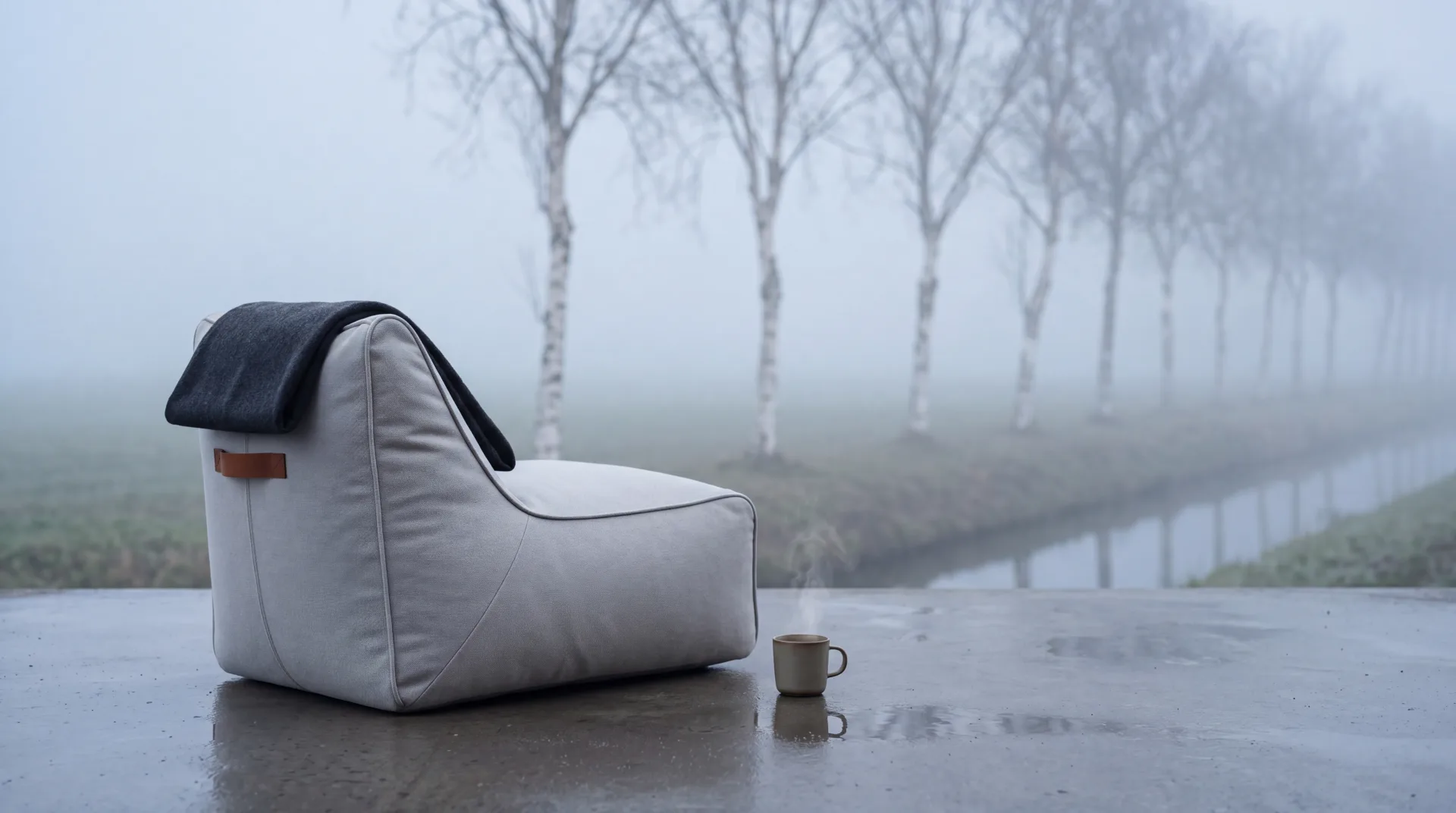 Mist-coloured ruusta lounge chair among Dutch birch trees